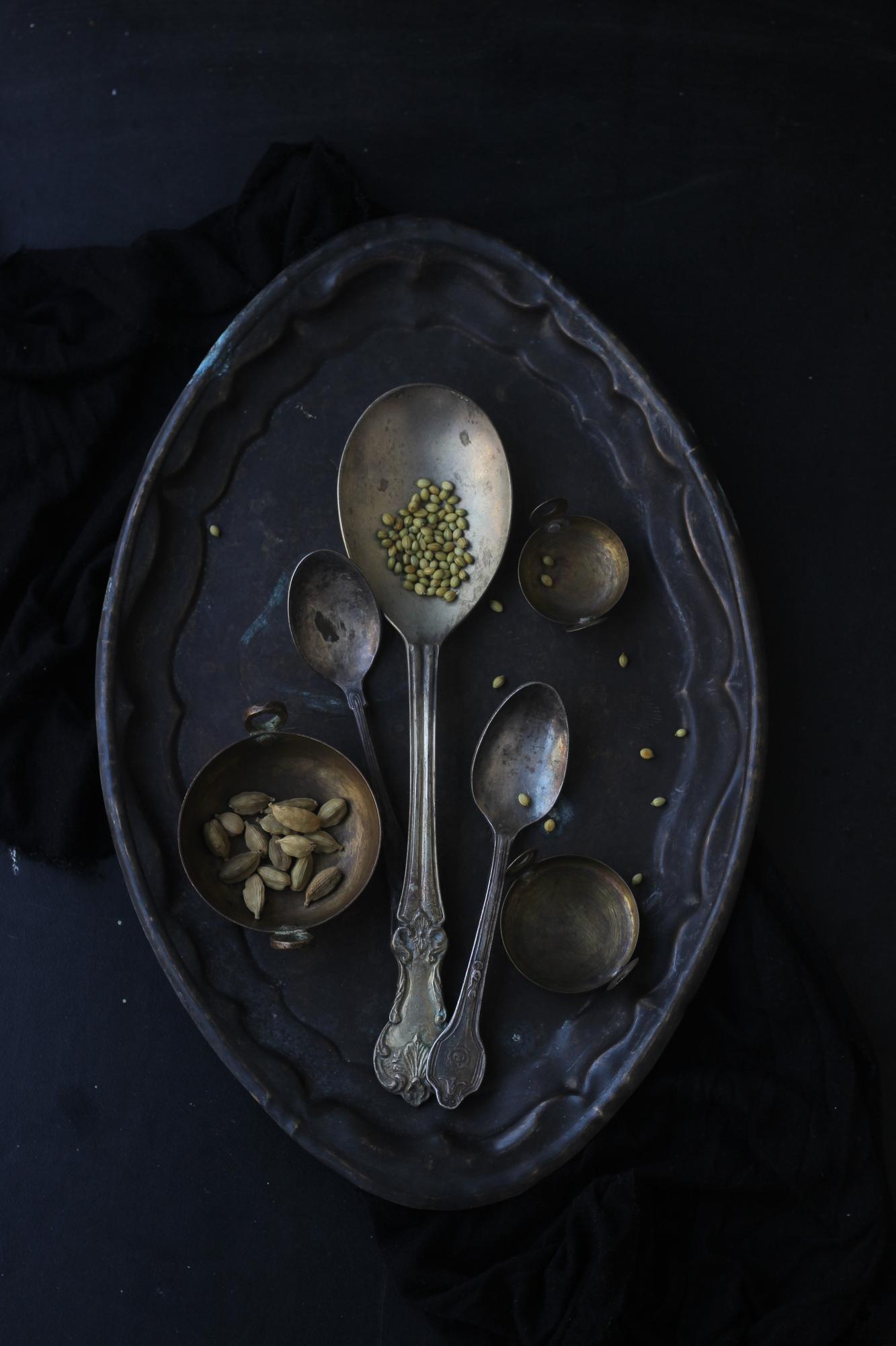 Plated haute cuisine with gold accents on dark table